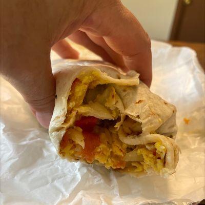 Breakfast burrito. So good. Beans rice eggs tomatoes onions cheese