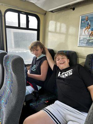 My boys on the shuttle from the parking lot.