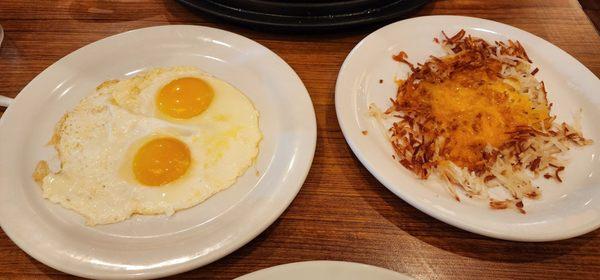 Side of eggs and cheesy hash browns