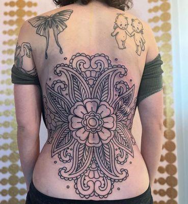 Ornamental backpiece tattoo by Kandace layne