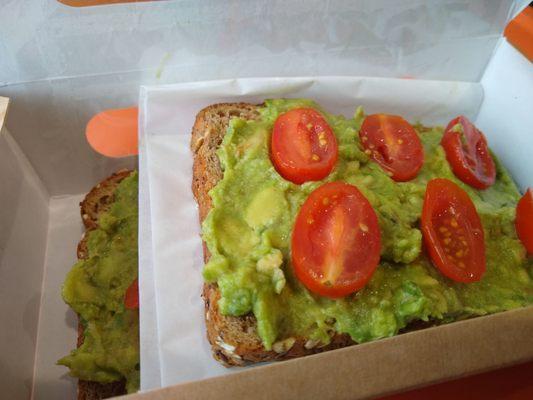 Avocado Toast - Simple. Comes automatically with sliced grape tomatoes on top.