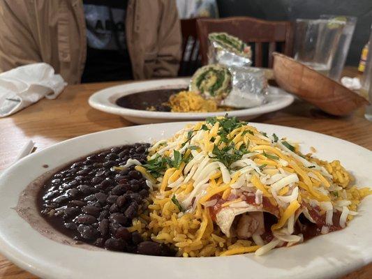 Enchilada dish with the burrito dish in the background