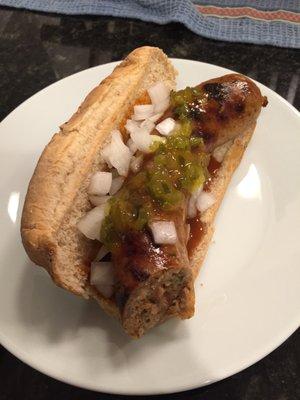 Grilled boudin with relish and fresh, diced onions.