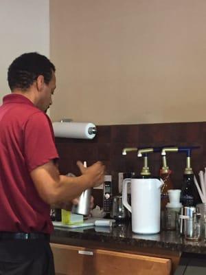 Doug, the owner and main barista, making fresh whipped cream for my hot chocolate.