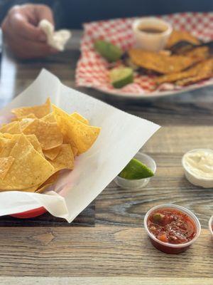 Taco birria with a side of chips