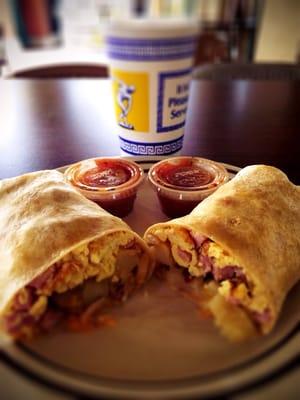 Breakfast burrito with ham egg cheese potatoes. The salsa is great.