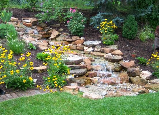 Stream and pond running through landscaping!