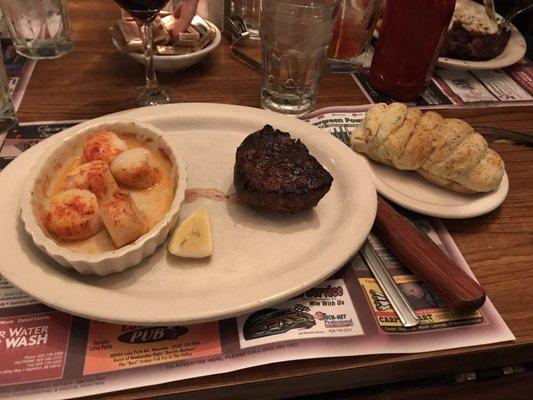 Filet with broiled scallops and a twice baked potato