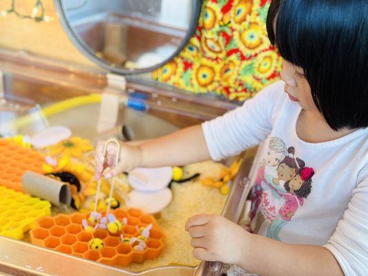 Working on finger strength and coordination in the sensory bin-