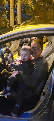 Like mother like son, loving those steering wheel buttons!