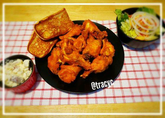 Potato salad, 12pc buffalo wings with bread and a side salad.