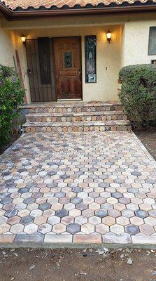 New pavers with border to accent the walkway. Includes staining the front door.