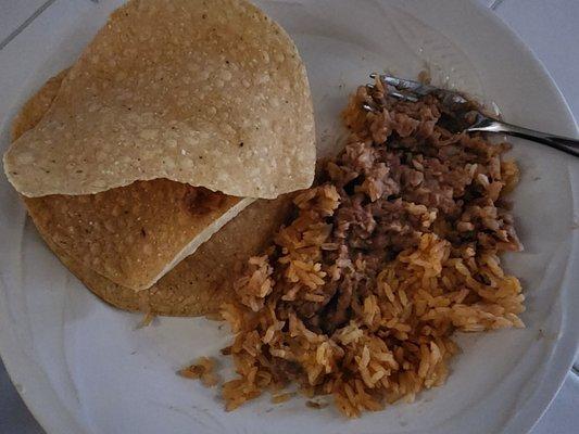 Here is the full order of beans and rice on a plate.