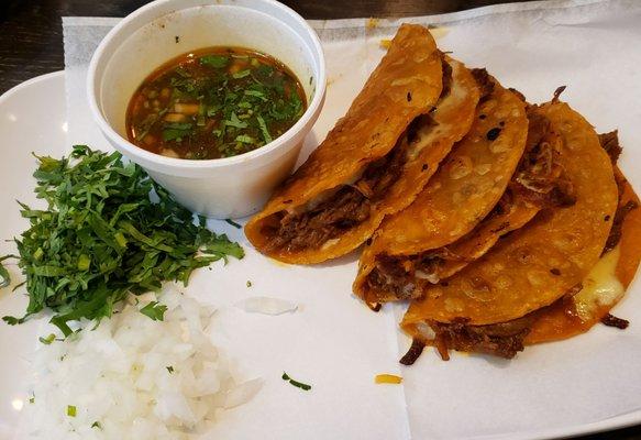 Quesabirrias ($14): a trio of DELICIOUS crispy, cheesy tacos filled w/brisket and served with dipping juice. 10/10