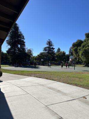 Playing bball smoking weed on the kids playground