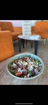 Strawberry fields salad- arugula goat cheese strawberry onions strawberries candied walnuts in honey balsamic dressing