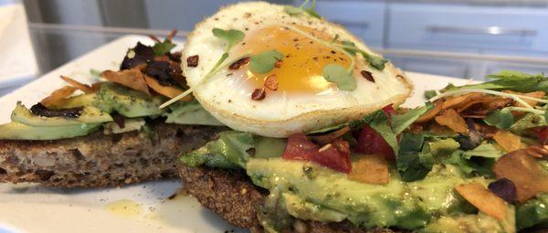 House Favorite; Avocado Toast with Coconut "Bakon" and egg! Delicious! Gluten Free option available!