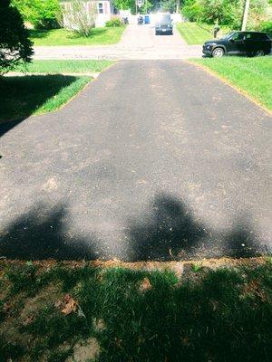 Please excuse the grass clippings but this our new driveway.