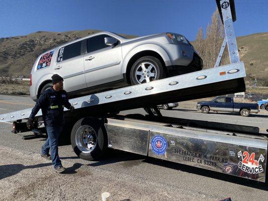 Tow Truck Driver Cody taking great care of our SUV!