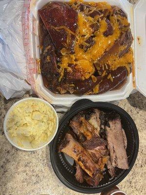 In the white container (FULLY LOADED POTATO), potato salad, and ribs and brisket