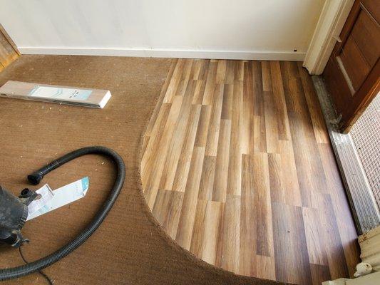 Vinyl plank installation for a custom entryway.