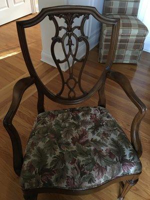 Old, skirted chair in background