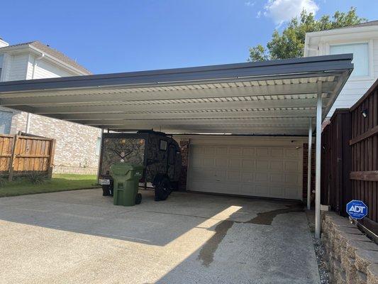 Carport awning over 3 car driveway.