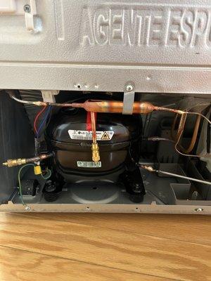 Install new compressor for LG refrigerator.