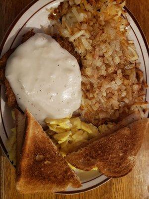 chicken fried steak, hashbrowns with onions.