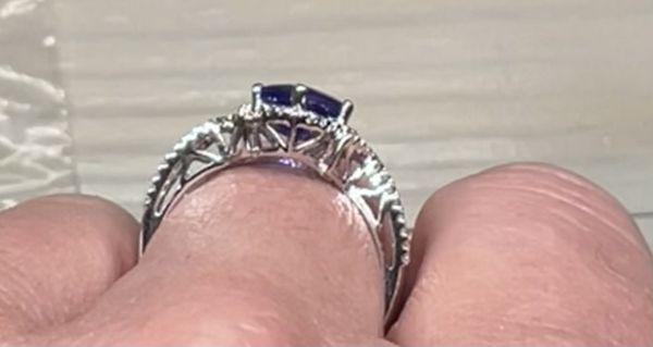 Beautiful tanzanite and diamond ring side view with great detail to add extra beauty to the ring