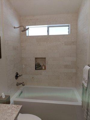 My new soaker tub and tile.  I wanted light stone color to make the room look bigger.  And now I love it!