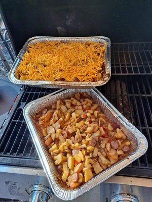 Smoked cheesy taters with onions and peppers and some spices, along with lots of butter