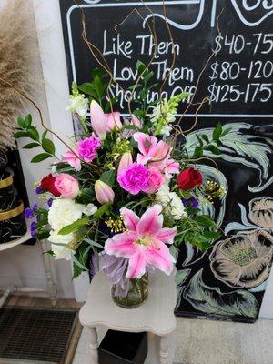 Stargazer Lilies stealing the show in this beautiful flower arrangement delivered in Toppenish.