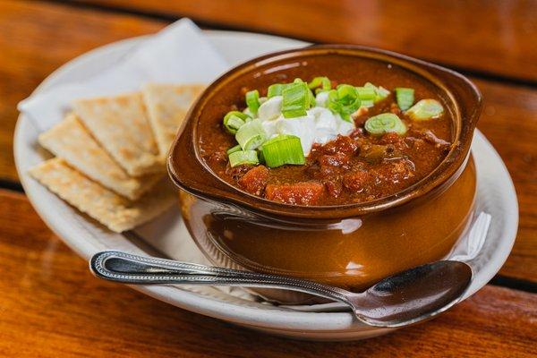 Venison Chili -  Topped with sour cream, scallions