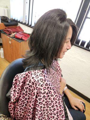 Side view of layered hair cut and style by Richard