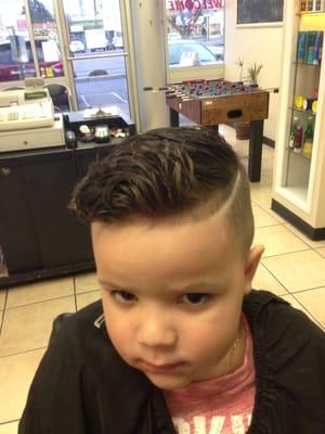 This little guy is a pro at getting his hair cut!