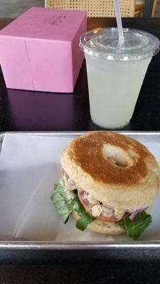 Chickplease salad on toasted bagel with lemonade