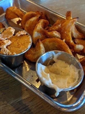 Fries with a cup of "cheese" on the side.