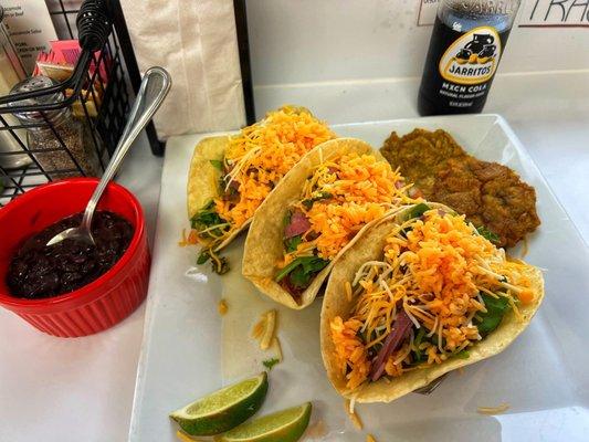 Pernil tacos w/ fried plantains and black beans