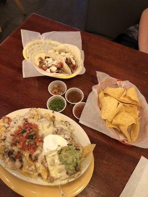 Steak/chicken tacos, chicken nachos, & chips w/ variety of salsas.