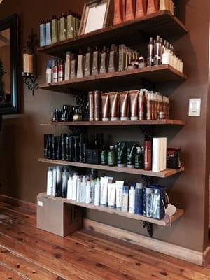 The waiting area with professional hair care displayed