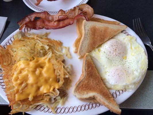 2 eggs with bacon, toast and hashbrowns smothered, chopped, and capped