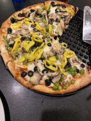 Veggie pizza minus 2 pieces.