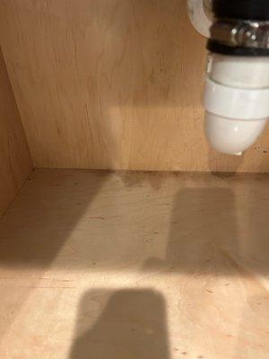 Water damage in cabinet from incorrect installation of water lines