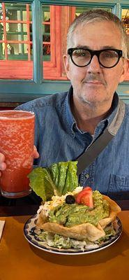 BRYAN, raising a glass with his Non-Alcoholic Margarita, and his Concha de Guacamole.