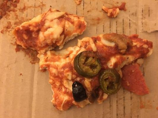 My cold, undercooked pizza. It fell apart when I attempted to retrieve it from the box.