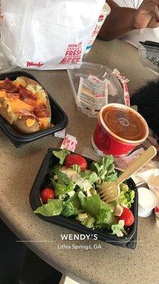 Bacon & cheese baked potato, chili, & a side house salad. Delicious and cheap. :D