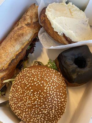 Lunch sandwiches, chocolate kronut, and a cinnamon roll