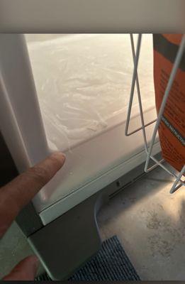 The problem. Ice forming at bottom of the freezer and dripping outside while defrosting