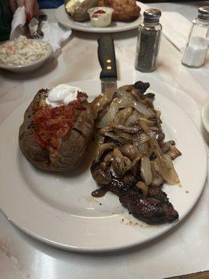 Friday Steak special, smothered in onions, mushrooms, and a loaded baked potato!